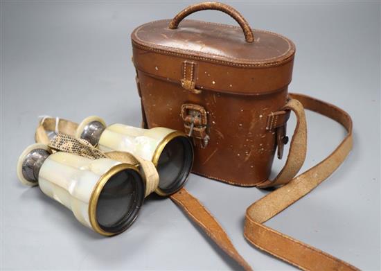 A pair of silver mounted Negretti and Zambra opera glasses, in original leather case